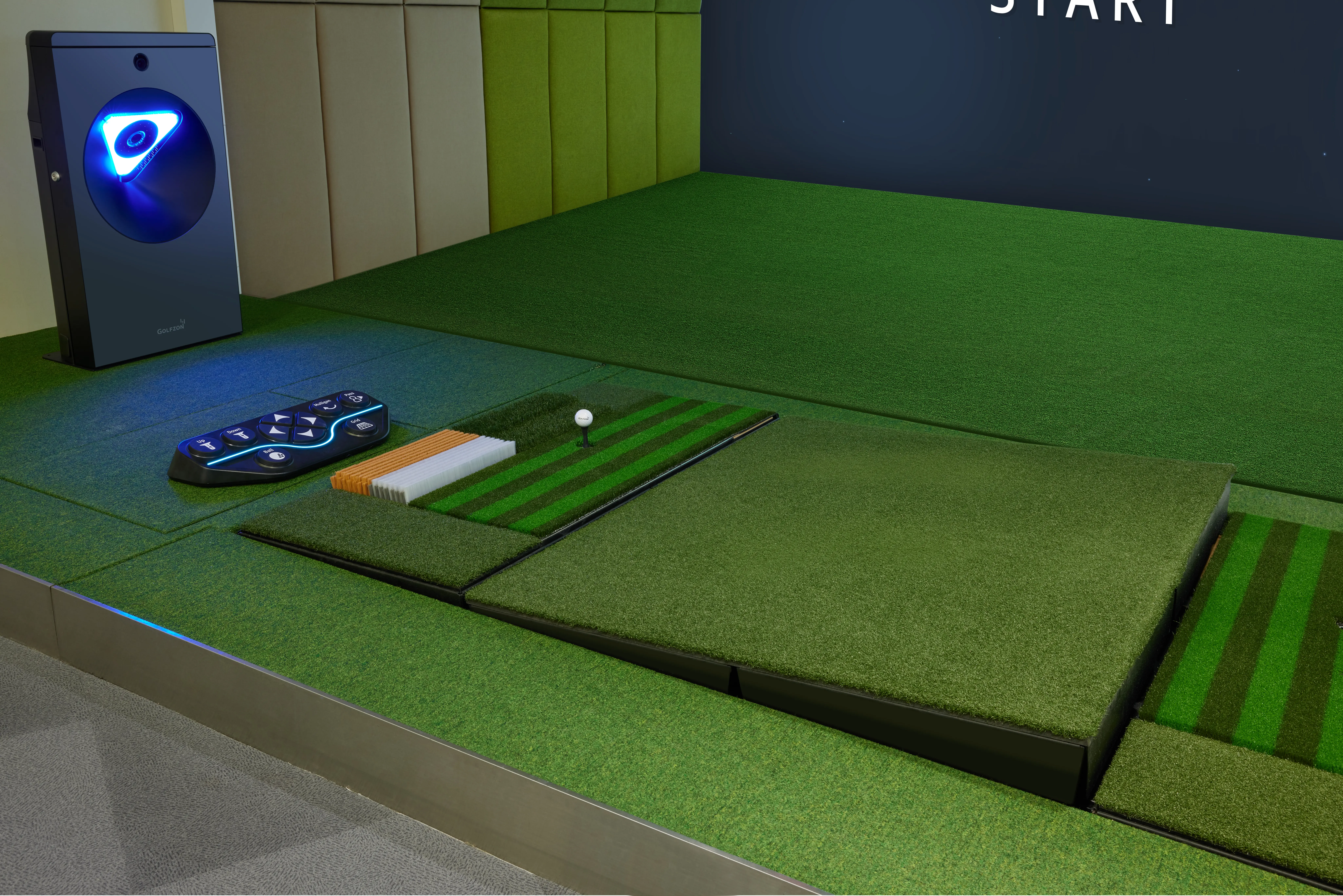 Three indoor golf simulator bays in a row